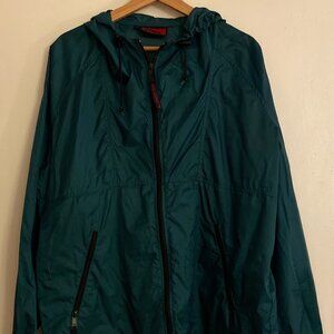 green rain jacket